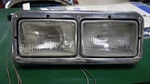 Peterbilt 320 2000: Headlamp Assembly. Fixed Price $100.00.