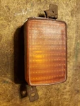 Yellow Ford Lens Stamped SAE-IP-74MG Top Rh. Fixed Price $5.50.