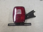 1973-1989 Ford Tail Light Assembly W/ License Lh Driver Side Sae Airst Tka. Fixed Price $45.00.