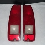 Pair Of Oem Ford 1967-72 F100 F250 Bronco Tail Light Covers SAE-TSIR-70TK. Fixed Price $75.00.