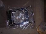 New Out Of Box Ford D5DB-13064-BD Left Drivers Side Headlight Lamp Bezel. Fixed Price $50.00.